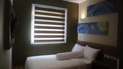 DJURAGAN KAMAR SLIPIにあるベッド