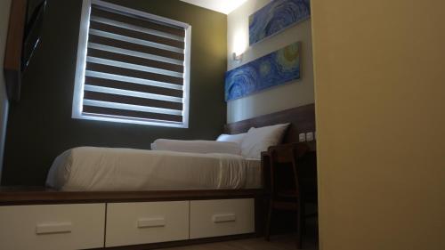 DJURAGAN KAMAR SLIPIにあるベッド