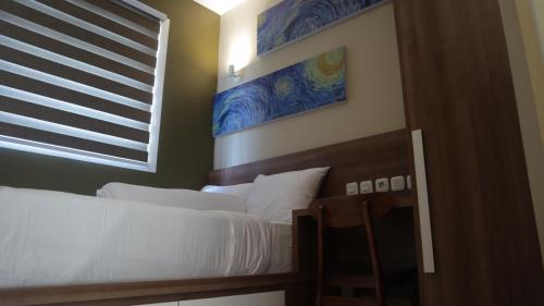 DJURAGAN KAMAR SLIPIにあるベッド