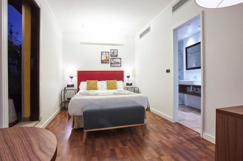 Cama o camas de una habitación en U-Sense Sevilla Centro