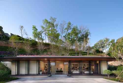 a house with a garden on the side of it at V Villas Phuket - MGallery Collection in Panwa Beach