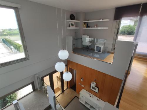 an overhead view of a bathroom with a mirror at Sanxenxo Casa Rial 47 con PISCINA CLIMATIZADA in Sanxenxo