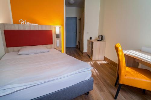 Katil atau katil-katil dalam bilik di Hotel am Stadtpark