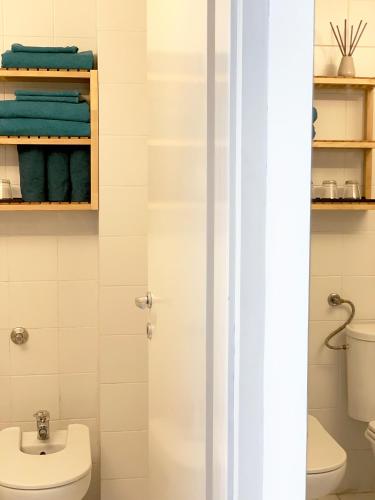 a bathroom with a toilet and a sink at Miu Arena Apartment in Belgrade