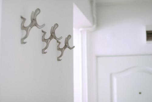 a group of antlers hanging on a wall at Miu Arena Apartment in Belgrade