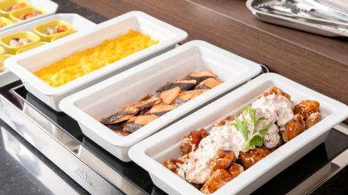 three styrofoam containers filled with food on a drawer at KOKO HOTEL Hidatakayama - formaly Hotel Wing Hida Takayama in Takayama