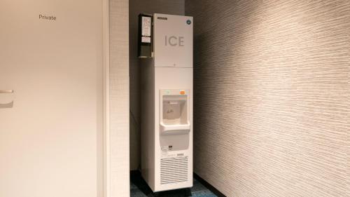 a ice machine on a wall in a room at KOKO HOTEL Hidatakayama - formaly Hotel Wing Hida Takayama in Takayama