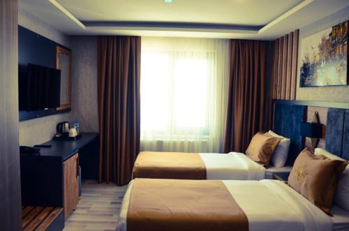 RUA WORLD HOTELにあるテレビまたはエンターテインメントセンター