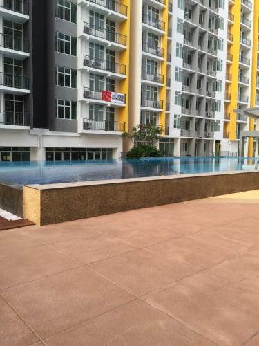 a walkway in front of some apartment buildings at Sv Mathrew studios in Nilai