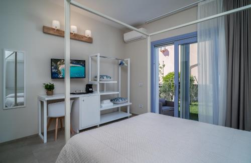 a bedroom with a bed and a desk and a window at Enjoy Your Stay - Guest House - Olbia in Olbia