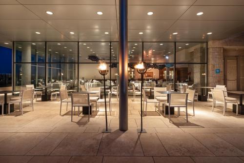 a restaurant with tables and chairs in a building at Valbusenda Hotel Bodega & Spa in Toro