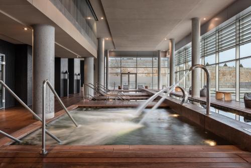 a pool of water in a building at Valbusenda Hotel Bodega & Spa in Toro