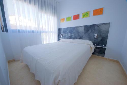 En eller flere senge i et værelse på Villa Arenal