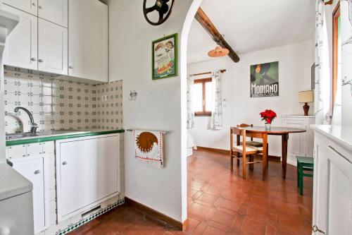 A kitchen or kitchenette at In the Clouds over Trastevere, penthouse studio