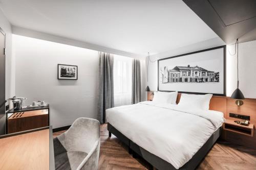 Кровать или кровати в номере Mercure Klaipeda City