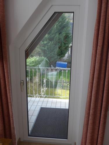 a door with a view of a balcony at Pension Schneider in Cochem