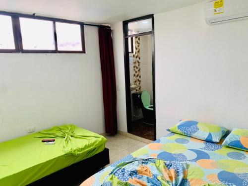 Voodi või voodid majutusasutuse Santa Marta Apartamentos Salazar - Caribe toas