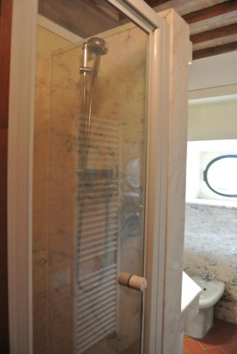 a shower with a glass door in a bathroom at Casa Torre in Arezzo