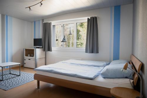 Postel nebo postele na pokoji v ubytování Beachhouse Isleten