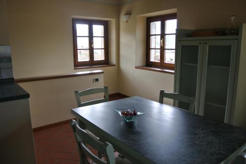a kitchen with a table with a bowl of fruit on it at Casa Torre in Arezzo