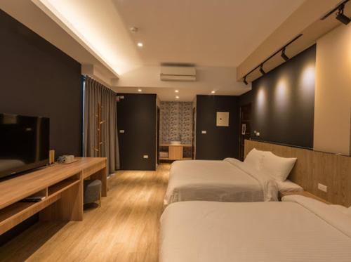 Postel nebo postele na pokoji v ubytování Yujing B&B 2
