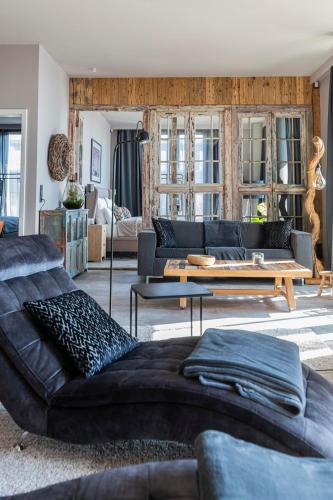 a living room with a couch and a table at Port of Travemünde, Opening 2021 in Travemünde