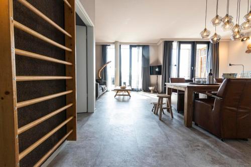 a living room with a kitchen and a dining room at Port of Travemünde, Opening 2021 in Travemünde