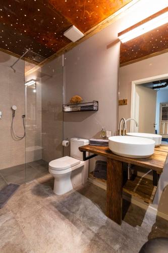 a bathroom with a sink and a toilet and a shower at Port of Travemünde, Opening 2021 in Travemünde