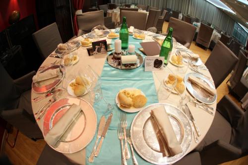 a long table with plates of food on it at Italiana Hotels Cosenza in Cosenza