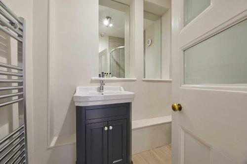 a bathroom with a sink and a mirror at Host & Stay - The Old Rectory in Witton Gilbert