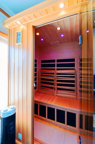 a sauna is shown in a room with wood at HOUSE K in Ichinomiya