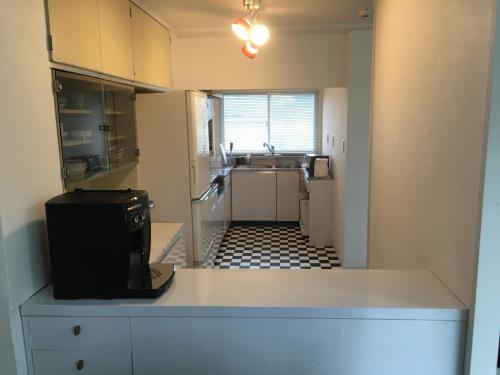 a kitchen with a sink and a counter top at HOUSE K in Ichinomiya
