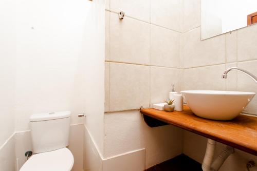 a bathroom with a sink and a toilet at Jeri Pousada in Jericoacoara