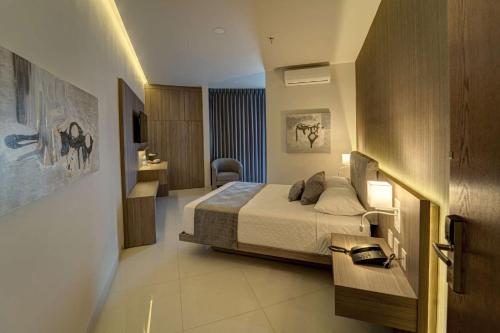 En eller flere senge i et værelse på Sara N Hotel & Spa