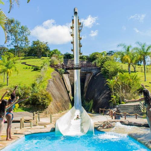 a water slide at a theme park with people on it at O Paraiso é aqui! in Barra do Piraí