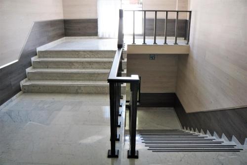a staircase in a building with a stair case at Hotel Del Rey in Mexico City