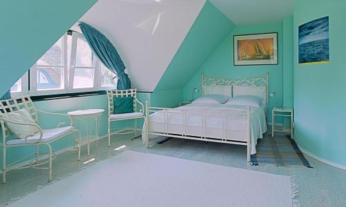 Un pat sau paturi într-o cameră la Drömhus