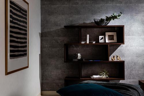 a living room with a black and gray wall at Little Santa in Ginowan