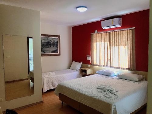 Postel nebo postele na pokoji v ubytování Hotel Dom Thomaz