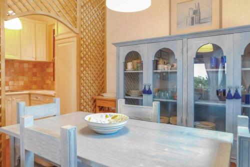 a kitchen with a table with a bowl on it at Villa Armonia - Nel cuore della Costa Smeralda in Abbiadori