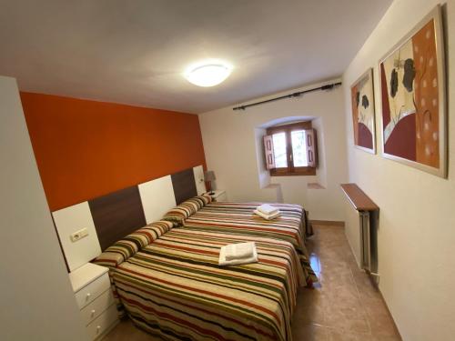 a room with a row of beds in it at Casa Murillo in Boltaña