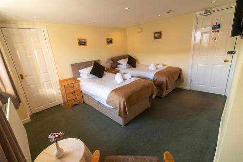 Cama o camas de una habitación en Auld Cross Keys Inn