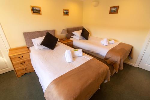 Cama o camas de una habitación en Auld Cross Keys Inn