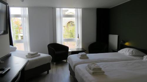 Katil atau katil-katil dalam bilik di Hotel Marktzicht