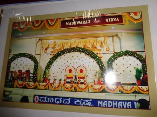 a window of a store with a display with two archways at Kediyoor Hotels in Udupi