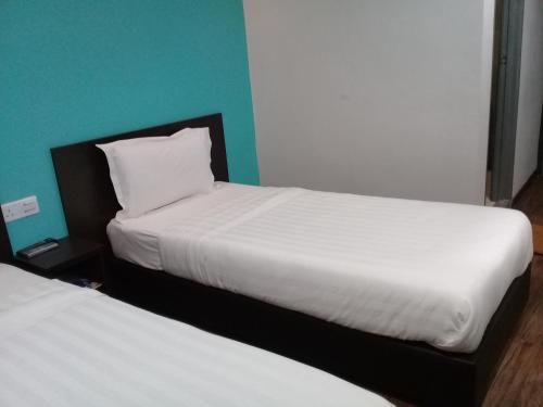 Clover Hotel Ipohにあるベッド