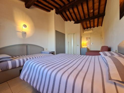 Un pat sau paturi într-o cameră la Hotel Da Graziano