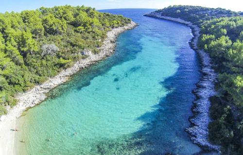 an aerial view of a beach with blue water at Villa Sofia Zavalatica in Čara