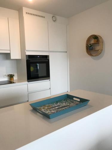 a kitchen counter with a tray on top of it at Whaaw Oostende in Ostend