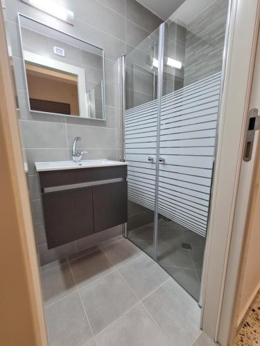 a bathroom with a sink and a shower at Rizik's Guest House in Nazareth
